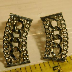 SARAH COVENTRY CLIP ON SILVER METAL EARRINGS.